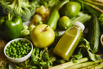 Image showing Green antioxidant organic vegetables, fruits and herbs placed on gray stone