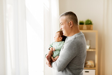 Image showing happy father holding with little baby son at home