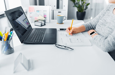 Image showing web designer working on user interface at office