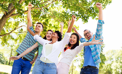 Image showing group of happy smiling friends having fun outdoors