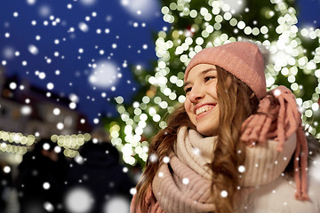 Image showing happy young woman at christmas market in winter