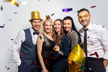 Image showing friends with party props and confetti laughing