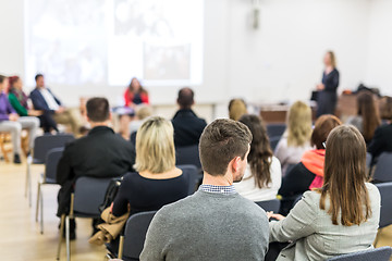 Image showing Woman giving presentation in lecture hall at university.