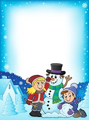 Image showing Kids building snowman theme frame 1