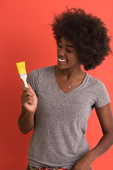 Image showing black woman painting wall