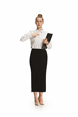 Image showing Full length portrait of a female teacher holding a folder isolated against white background
