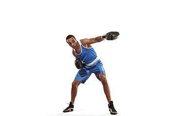 Image showing Sporty man during boxing exercise making hit. Photo of boxer on white background