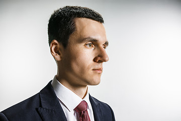 Image showing Three-quarter portrait of a businessman with very serious face. Confident professional with piercing look in the foreground of the camera.