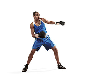 Image showing Sporty man during boxing exercise making hit. Photo of boxer on white background