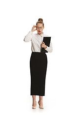 Image showing Full length portrait of female teacher with a headache holding a folder isolated against white background