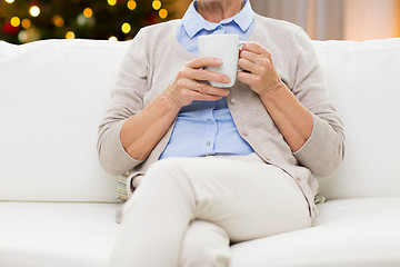 Image showing close up of senior woman with tea cup on christmas