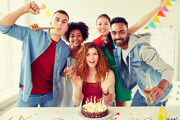 Image showing happy coworkers with cake at office birthday party