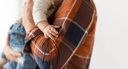 Image showing close up of father holding little baby