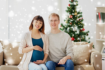 Image showing pregnant wife with husband at home at christmas