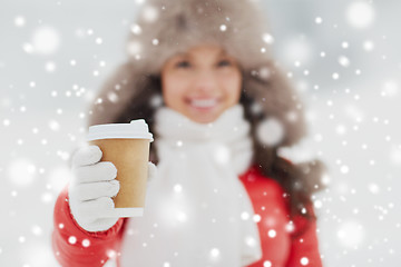 Image showing happy woman with coffee cup in winter