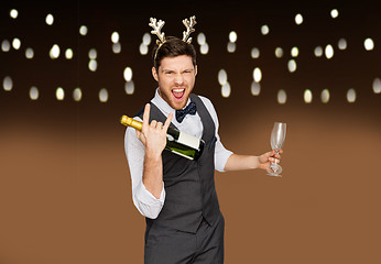 Image showing man with bottle of champagne at christmas party