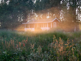 Image showing House behind cloud in sunset light