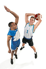 Image showing Full length portrait of a basketball players with ball
