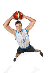 Image showing Full length portrait of a basketball player with ball