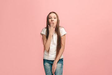 Image showing Beautiful teen girl looking suprised isolated on pink