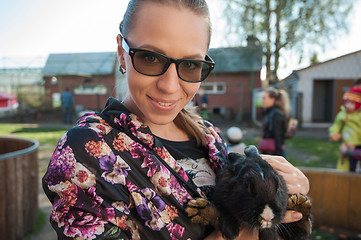 Image showing Young woman with rabbit