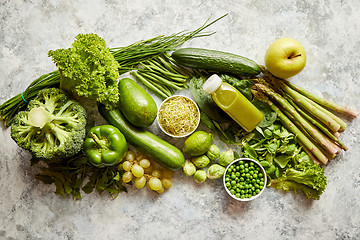 Image showing Green antioxidant organic vegetables, fruits and herbs placed on gray stone