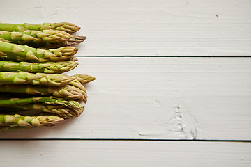 Image showing Above view of flat-lay organic raw uncooked green asparagus