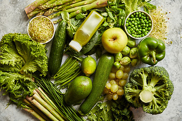 Image showing Green antioxidant organic vegetables, fruits and herbs placed on gray stone