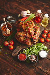 Image showing Roasted whole chicken or turkey served with chilli pepers and chive