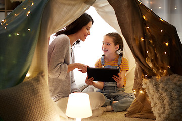 Image showing family with tablet pc in kids tent at home