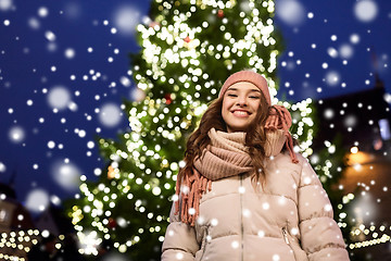 Image showing happy young woman at christmas in winter