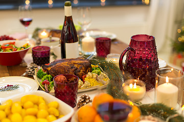 Image showing food and drinks on christmas table at home