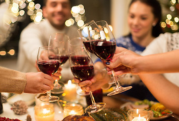 Image showing close up of friends with wine celebrate christmas