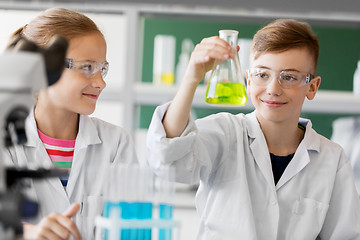 Image showing kids with test tubes studying chemistry at school