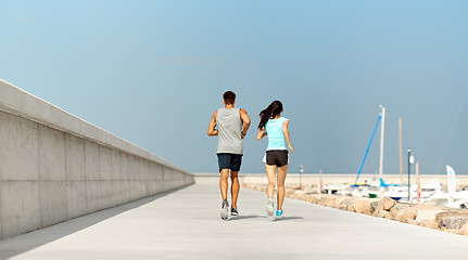 Image showing couple in sports clothes running outdoors