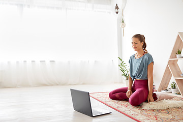 Image showing woman with laptop computer at yoga studio