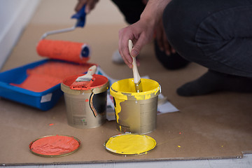 Image showing painters prepare color for painting