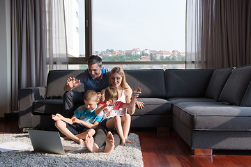 Image showing Family Playing Together with laptop computer