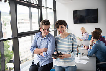 Image showing Two Business People Working With Tablet in office