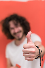 Image showing man with funny hair over color background with brush