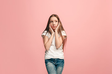 Image showing Young serious thoughtful teen girl. Doubt concept.