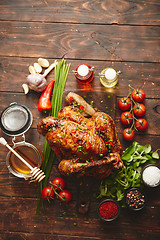 Image showing Roasted whole chicken or turkey served with chilli pepers and chive