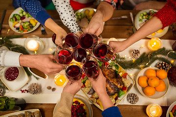 Image showing close up of friends with wine celebrate christmas