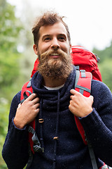 Image showing bearded traveler with backpack in woods