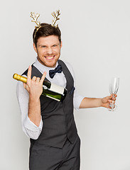 Image showing man with bottle of champagne at christmas party