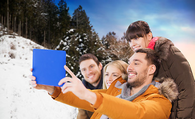 Image showing happy friends taking selfie by tablet pc in winter