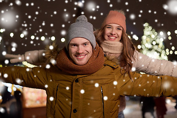 Image showing happy couple having fun at christmas market