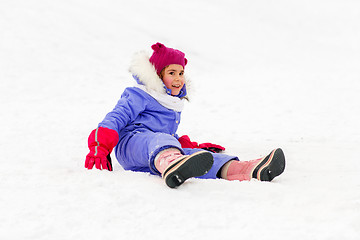 Image showing happy little girl in winter clothes outdoors