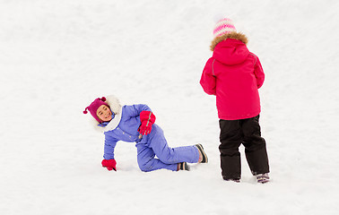 Image showing happy little girls playing outdoors in winter