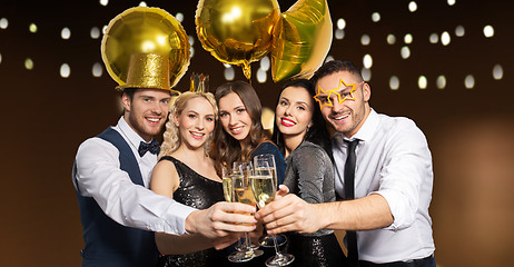 Image showing happy friends clinking champagne glasses at party